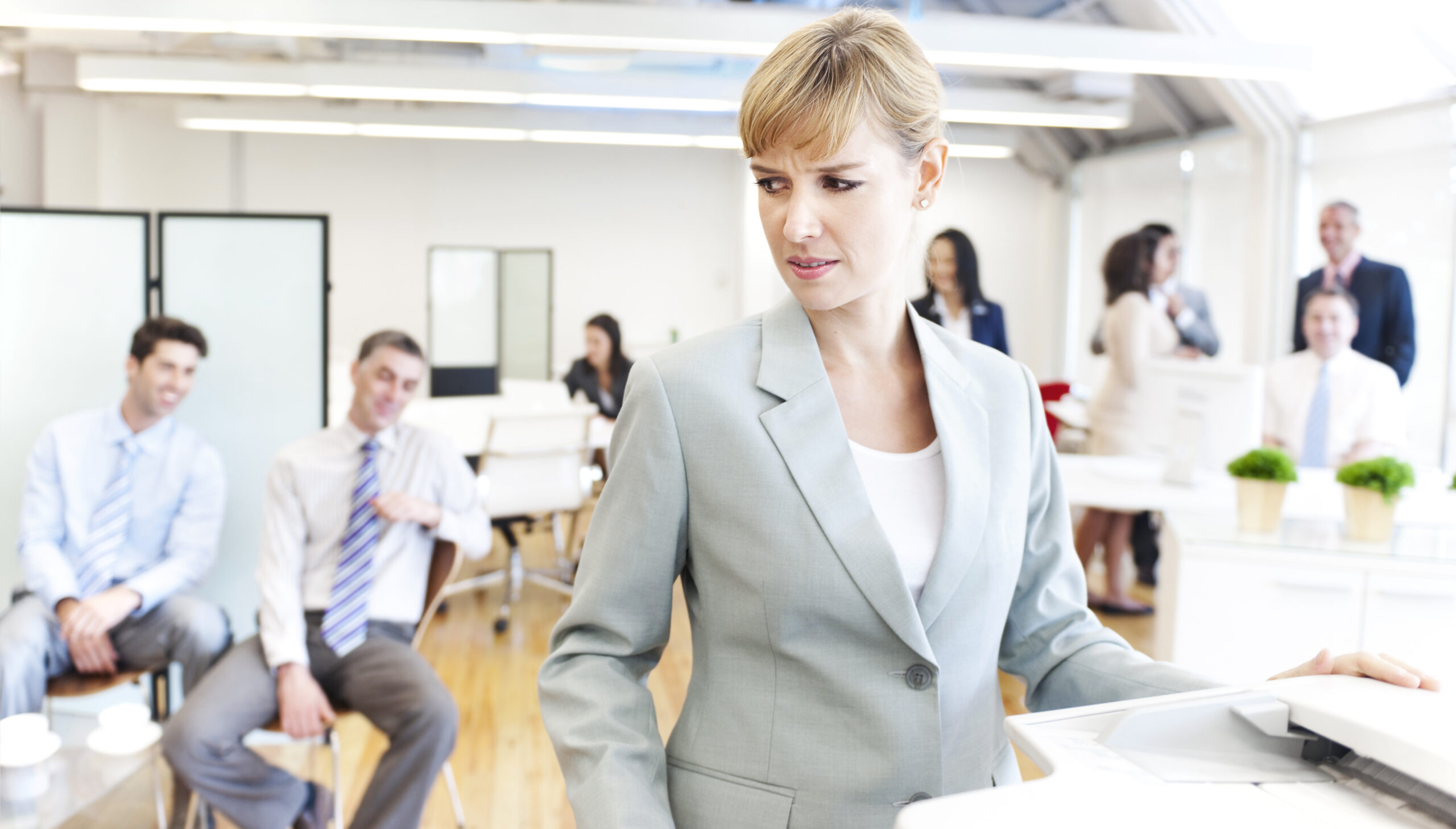 A female employee being sexually harassed at work