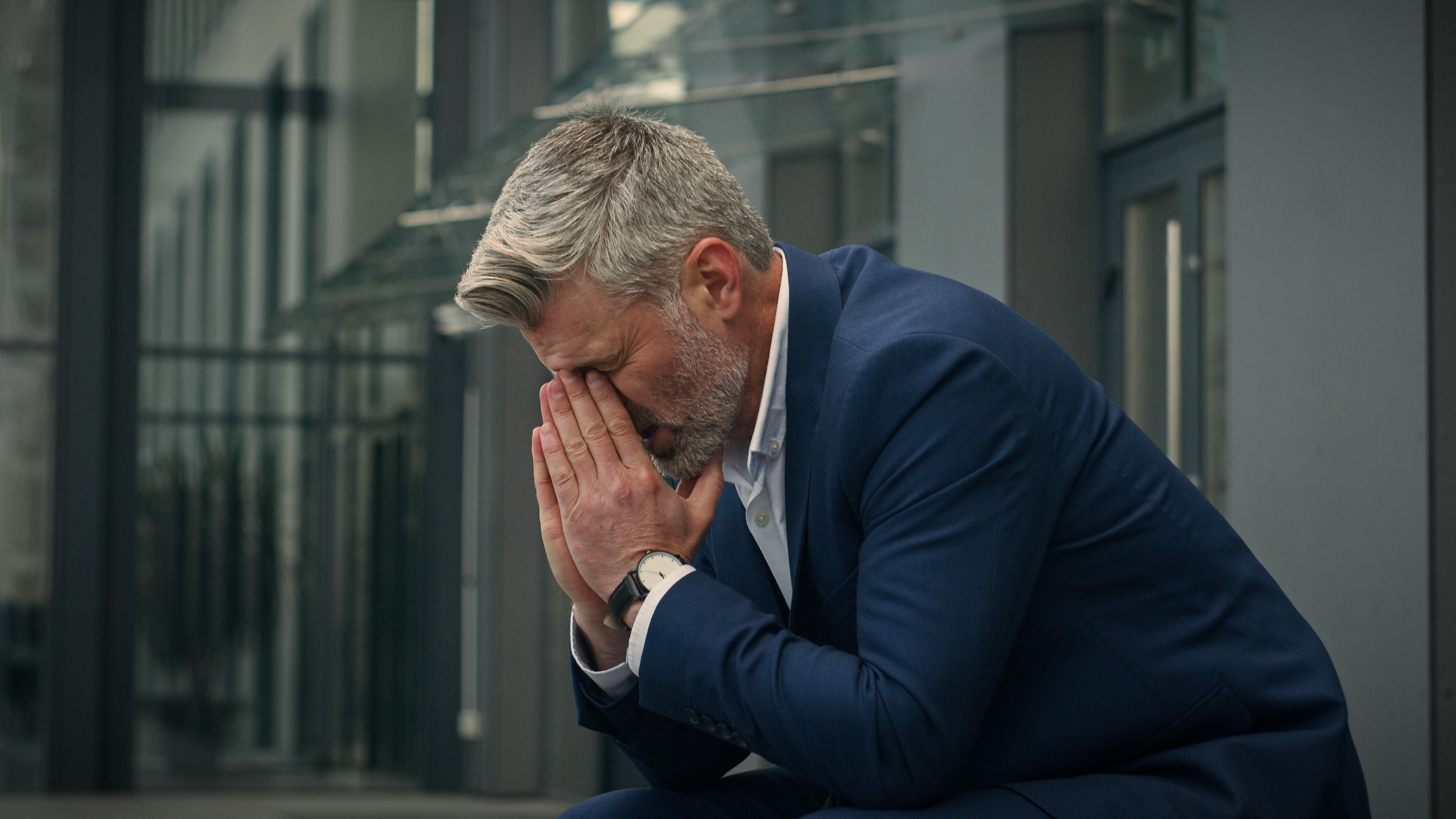 Pensive Caucasian middle-aged old man feeling headache eyes strain discomfort thinking thoughtful unwell senior businessman worried problem migraine worry failure mature business male in city outdoors. High quality 4k footage