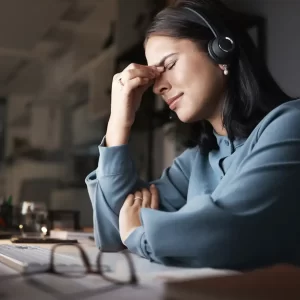 A women feeling stressed after being harassed at work